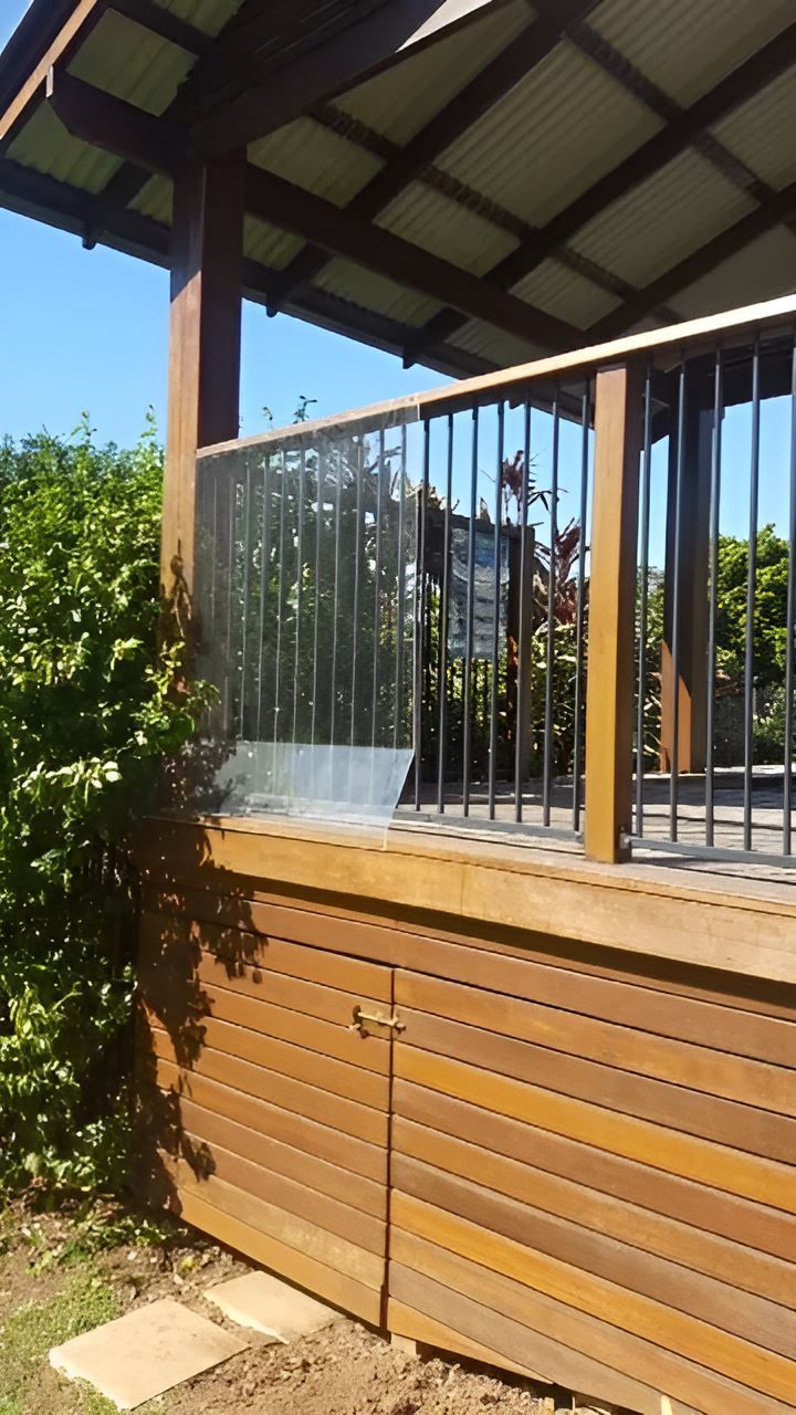 A Wooden Deck With A Metal Railing And A Door — Bent Plastics in Kunda Park, QLD