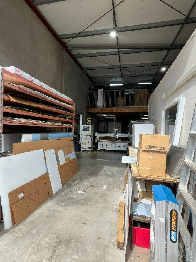 A Warehouse Filled With Lots of Boxes and a Ladder — Bent Plastics in Kunda Park, QLD