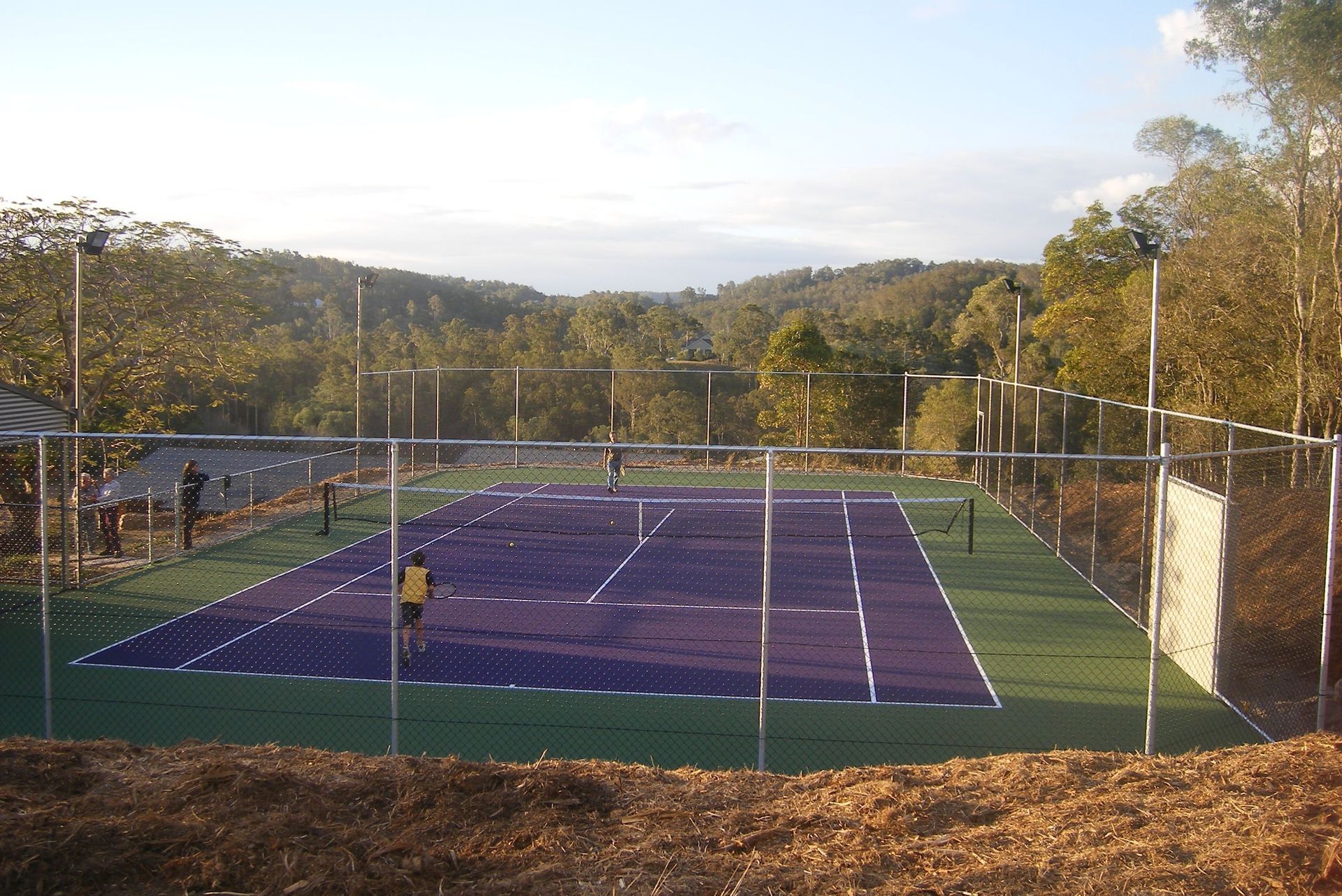 Purple Tennis Court with a Fence — Queensland, Australia — Jordin Sports Constructions