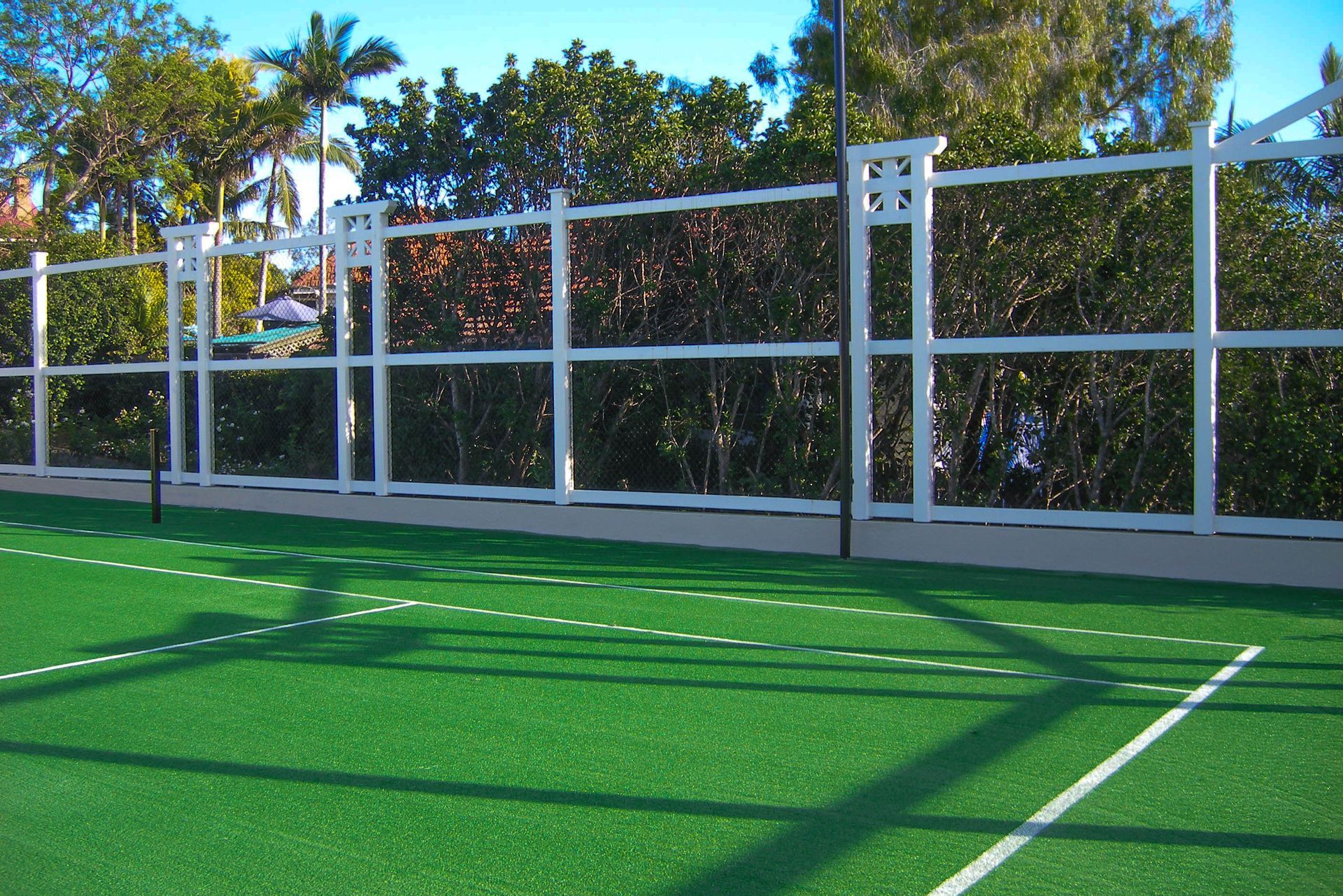 Tennis Court with a White Fence Surrounding It — Queensland, Australia — Jordin Sports Constructions