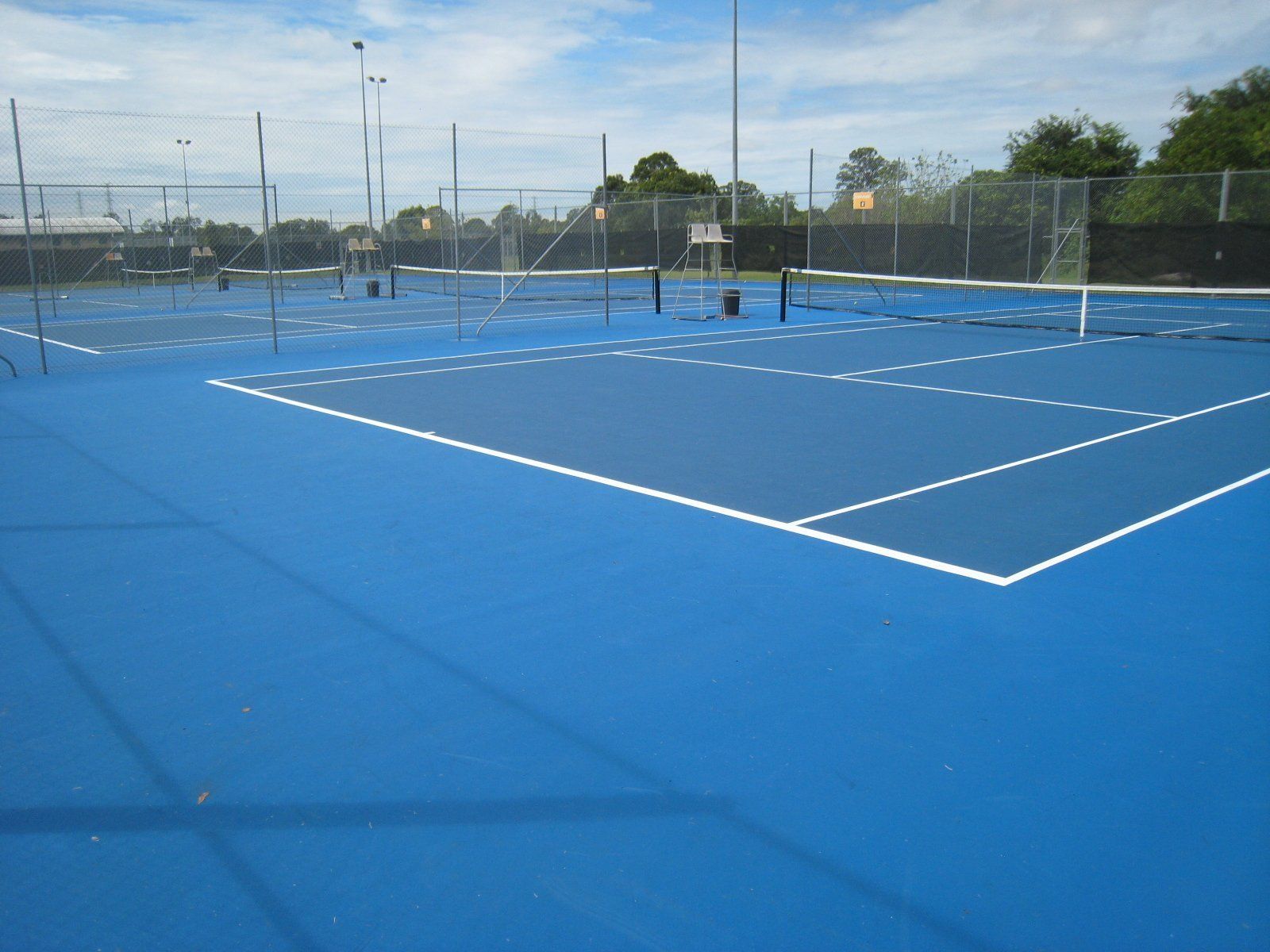 Blue Tennis Court with White Lines — Queensland, Australia — Jordin Sports Constructions