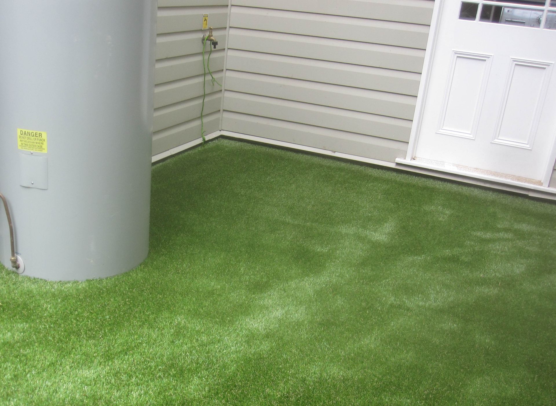 A Water Heater on Top of a Lush Green Lawn — Queensland, Australia — Jordin Sports Constructions