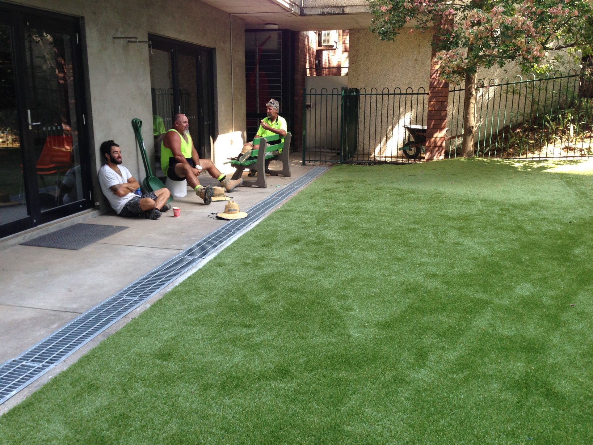 A Group of Men Sitting on a Patio in a Backyard — Queensland, Australia — Jordin Sports Constructions