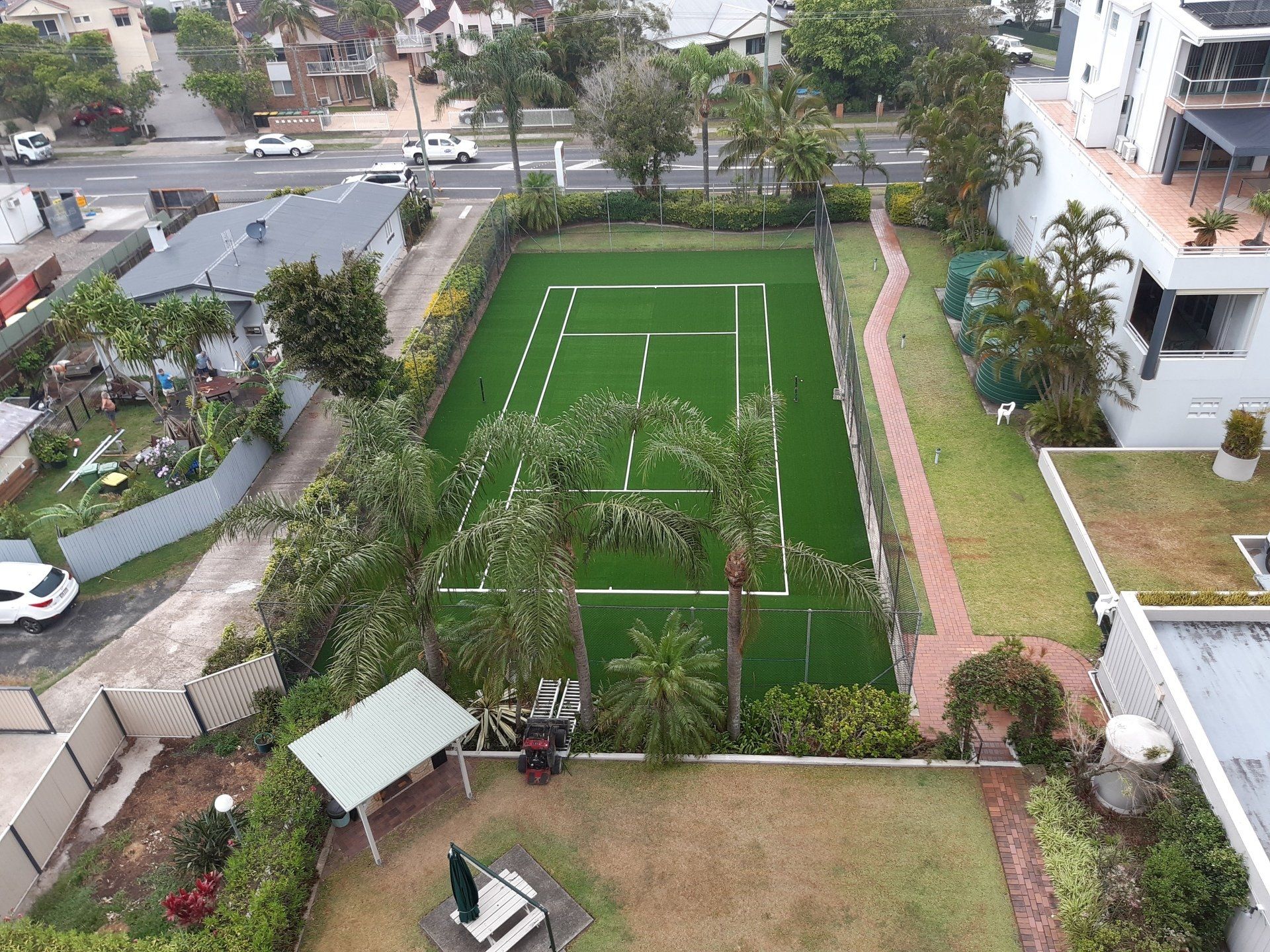 Aerial View of a Tennis Court in a Residential Area — Queensland, Australia — Jordin Sports Constructions