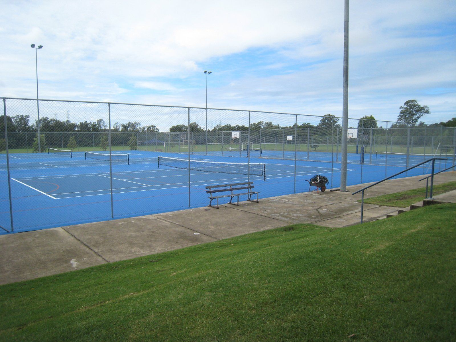 A Blue Tennis Court with a Fence — Queensland, Australia — Jordin Sports Constructions