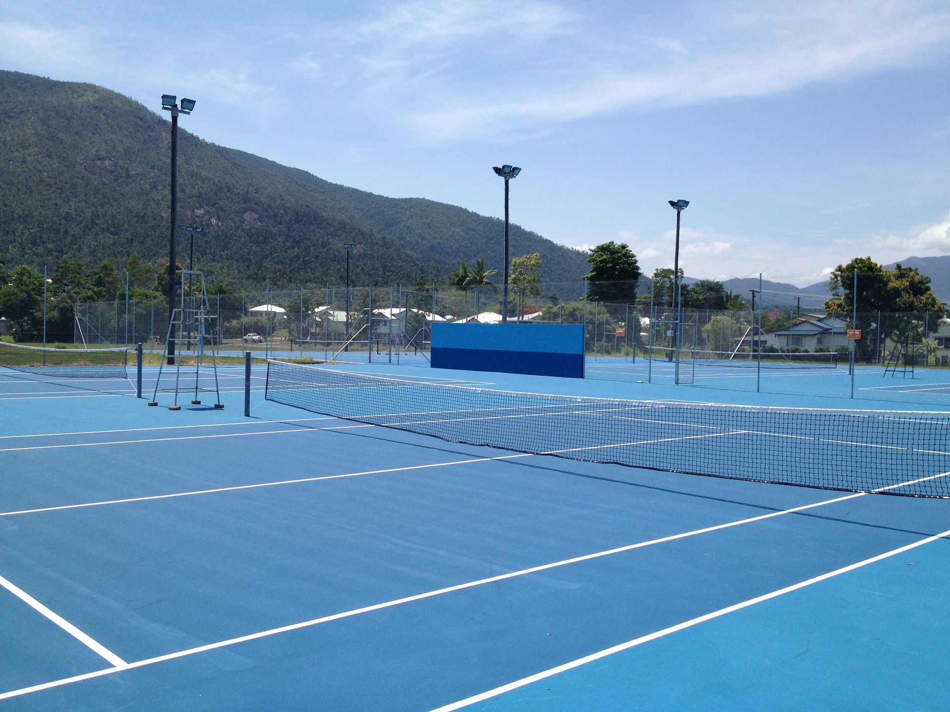 A Blue Tennis Court with Mountains in the Background — Queensland, Australia — Jordin Sports Constructions