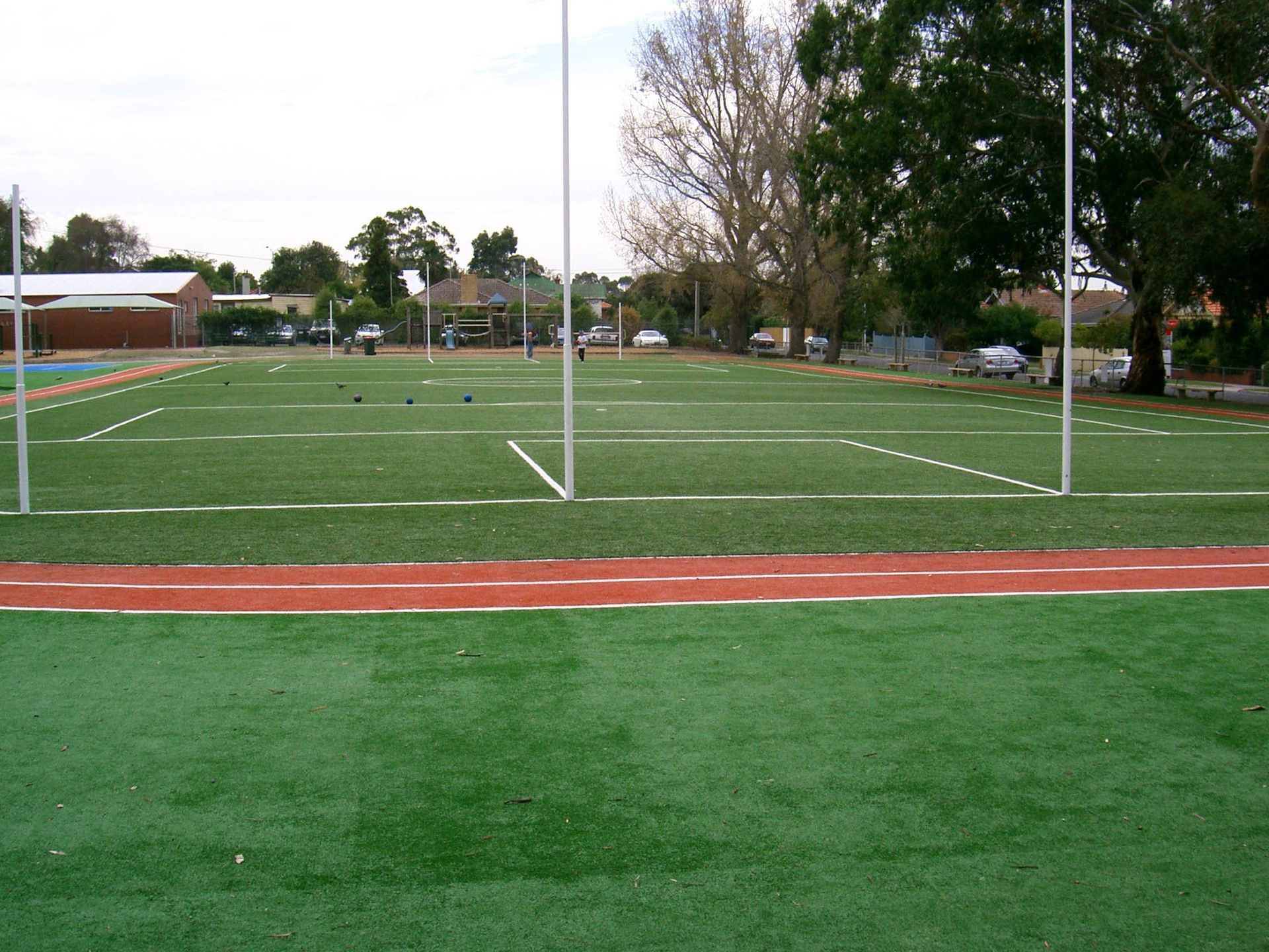 Soccer Field with a Red Track in the Middle — Queensland, Australia — Jordin Sports Constructions
