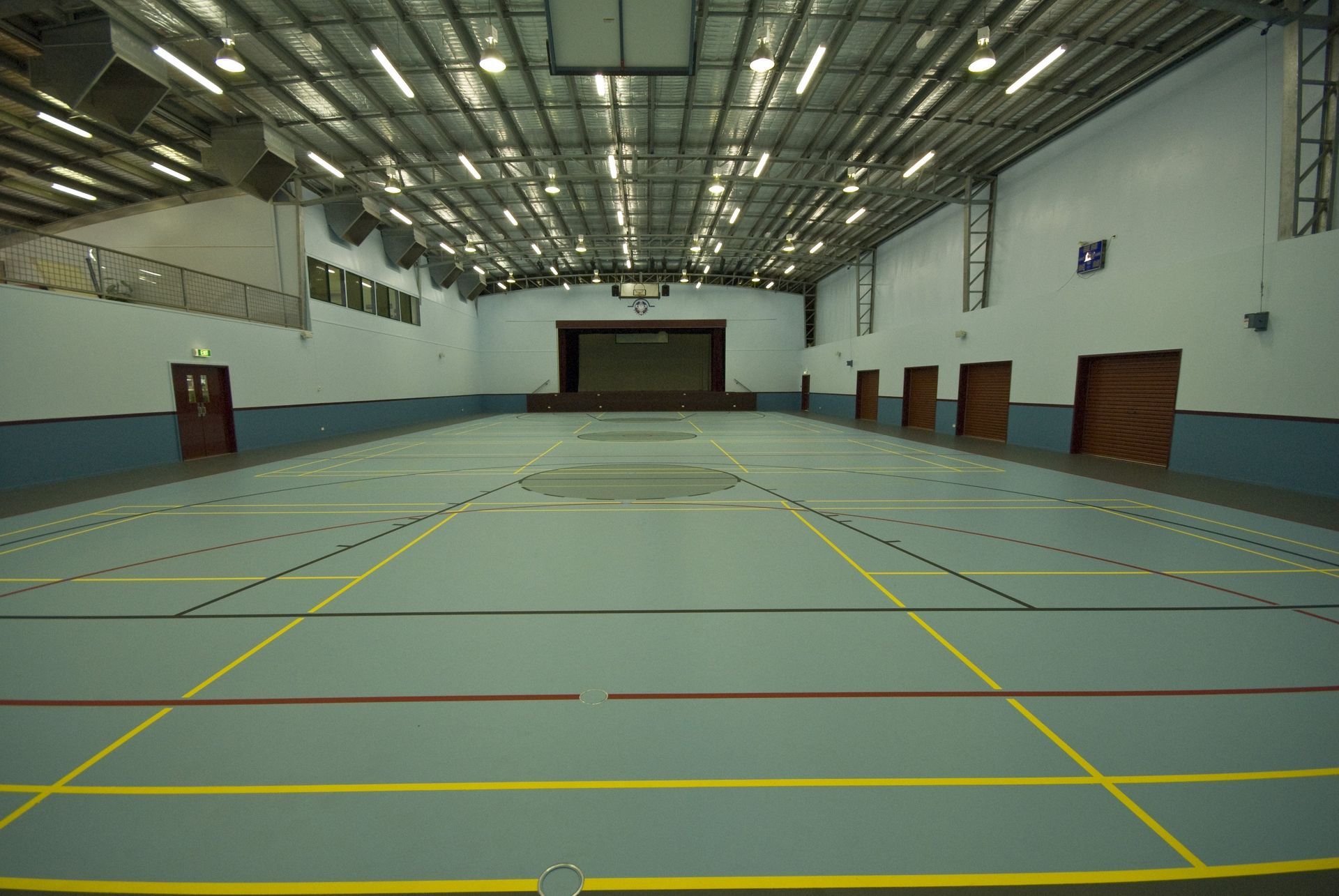 Large Empty Gym with a Stage in the Middle — Queensland, Australia — Jordin Sports Constructions