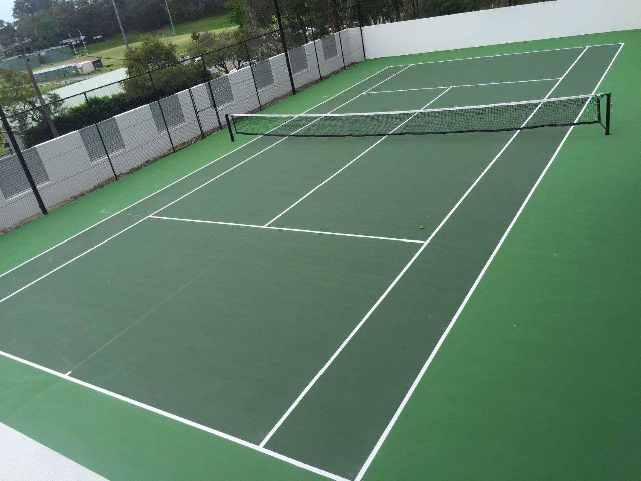 Green Tennis Court with White Lines and a Net — Queensland, Australia — Jordin Sports Constructions