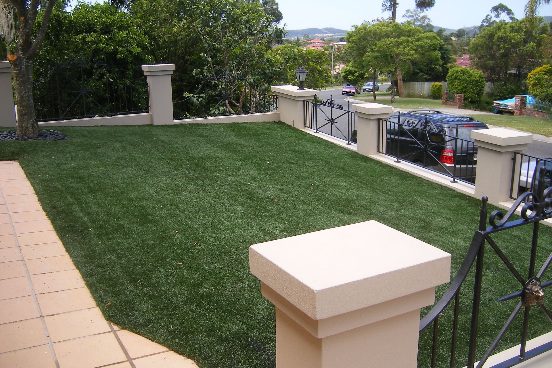 A Lawn With a White Pillar in the Middle of It — Queensland, Australia — Jordin Sports Constructions