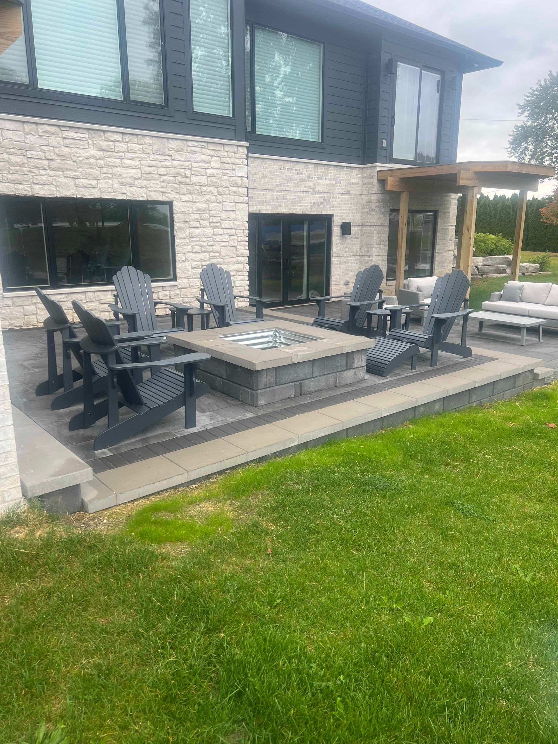 Patio & Fire Pit Installation on New construction on White Lake, MI.  K&T Landscape Services