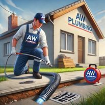 A plumber is working on a drain in front of a house.