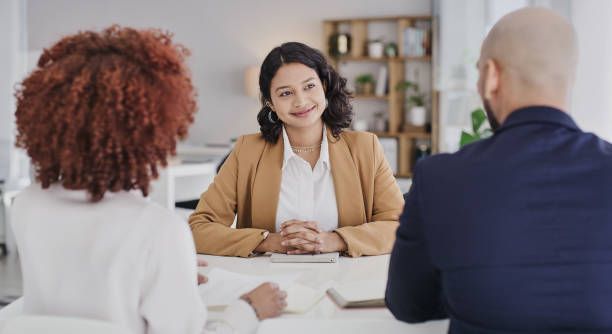 Temporary staffing agency consultant meeting with clients to discuss employment opportunities.