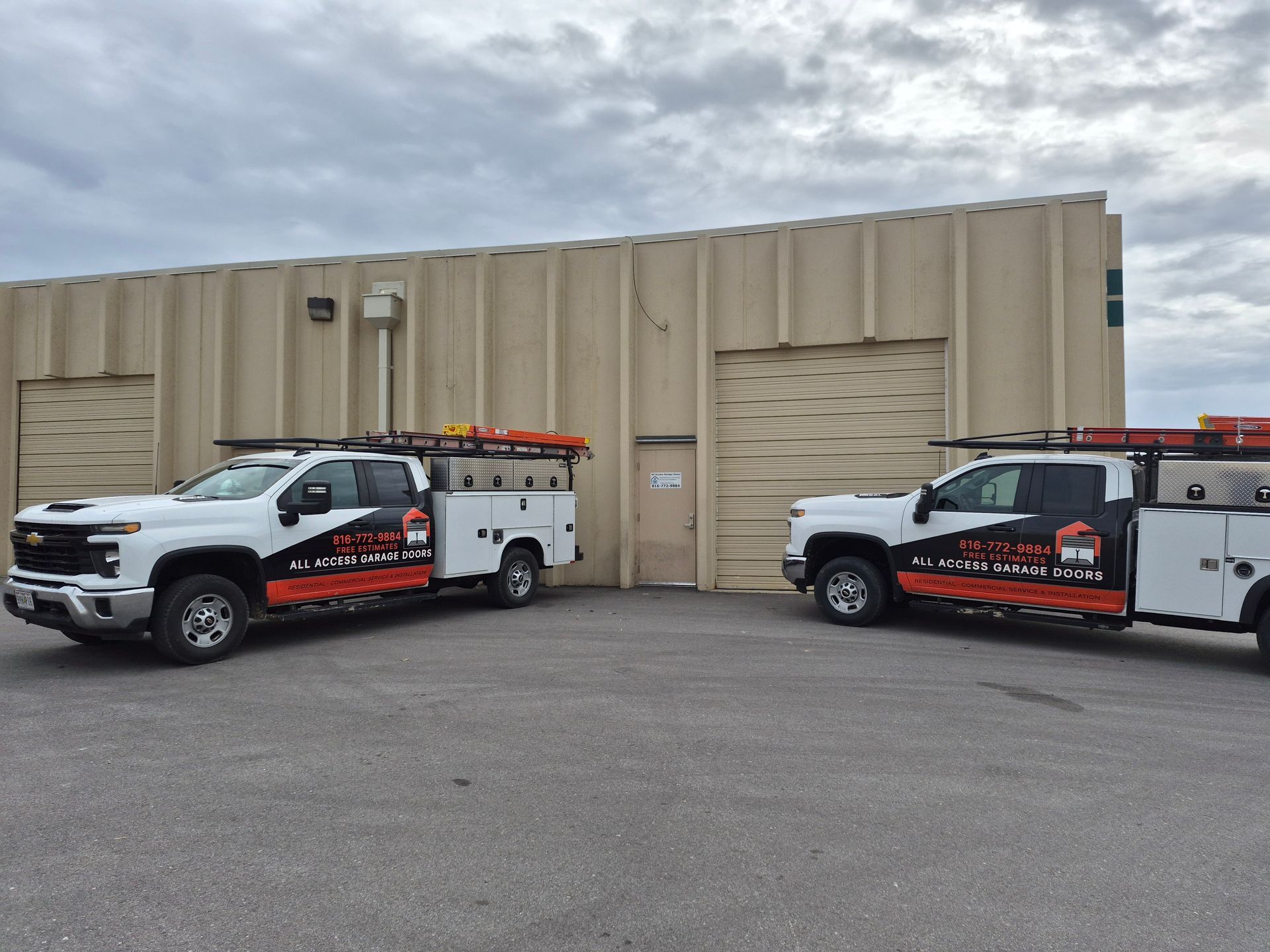 White work truck with orange and black logo: 