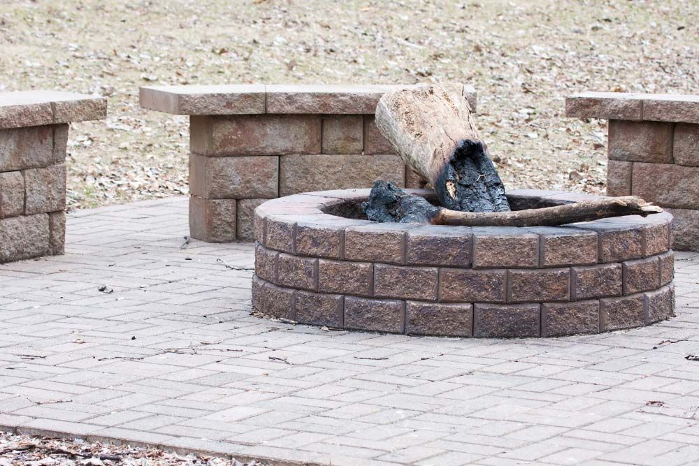 Concrete Fire Pit With Wood in Jacksonville, FL