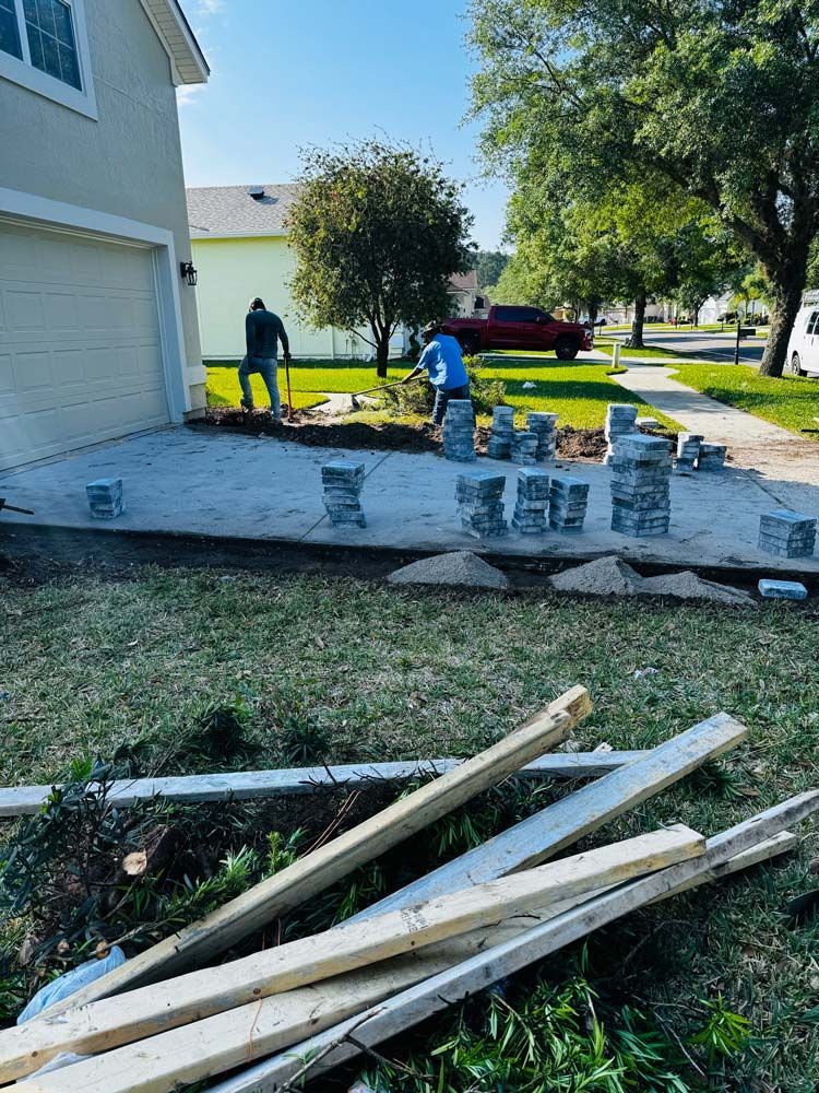 Men With Shovel Installing Concrete Driveway in Jacksonville, FL
