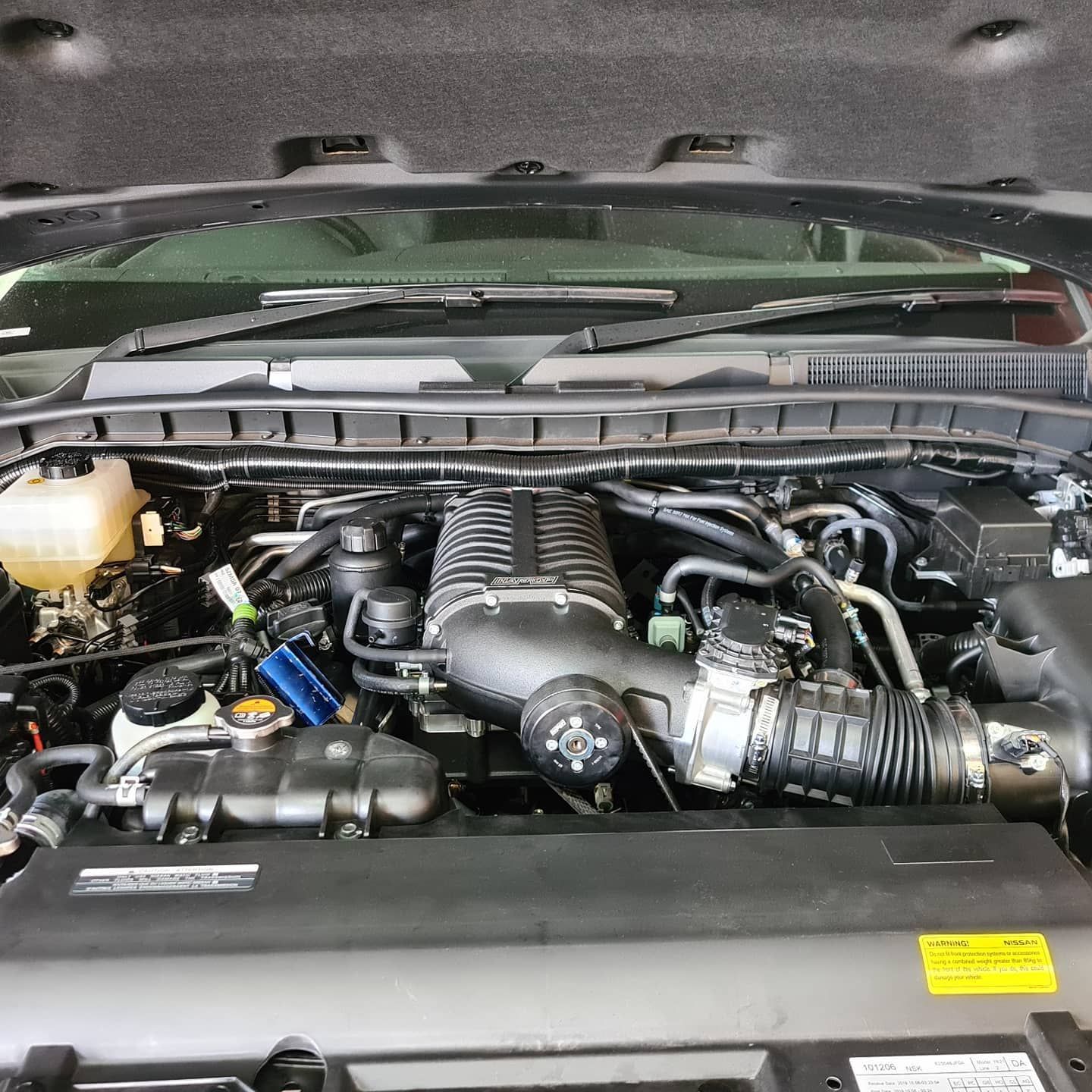 A Close Up of a Car Engine With the Hood Open — SVS Auto Repairs & Dyno Tuning in Bungalow, QLD