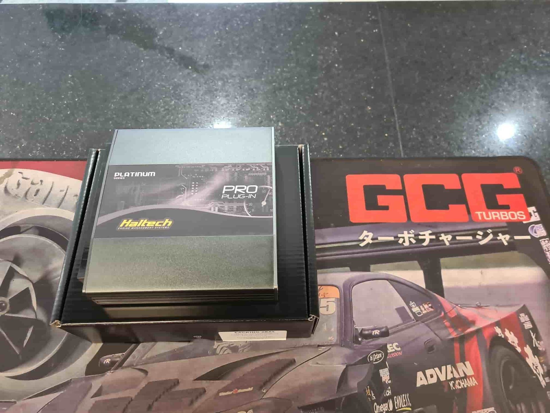 A Close Up of a Battery With Cables Attached to It — SVS Auto Repairs & Dyno Tuning in Bungalow, QLD