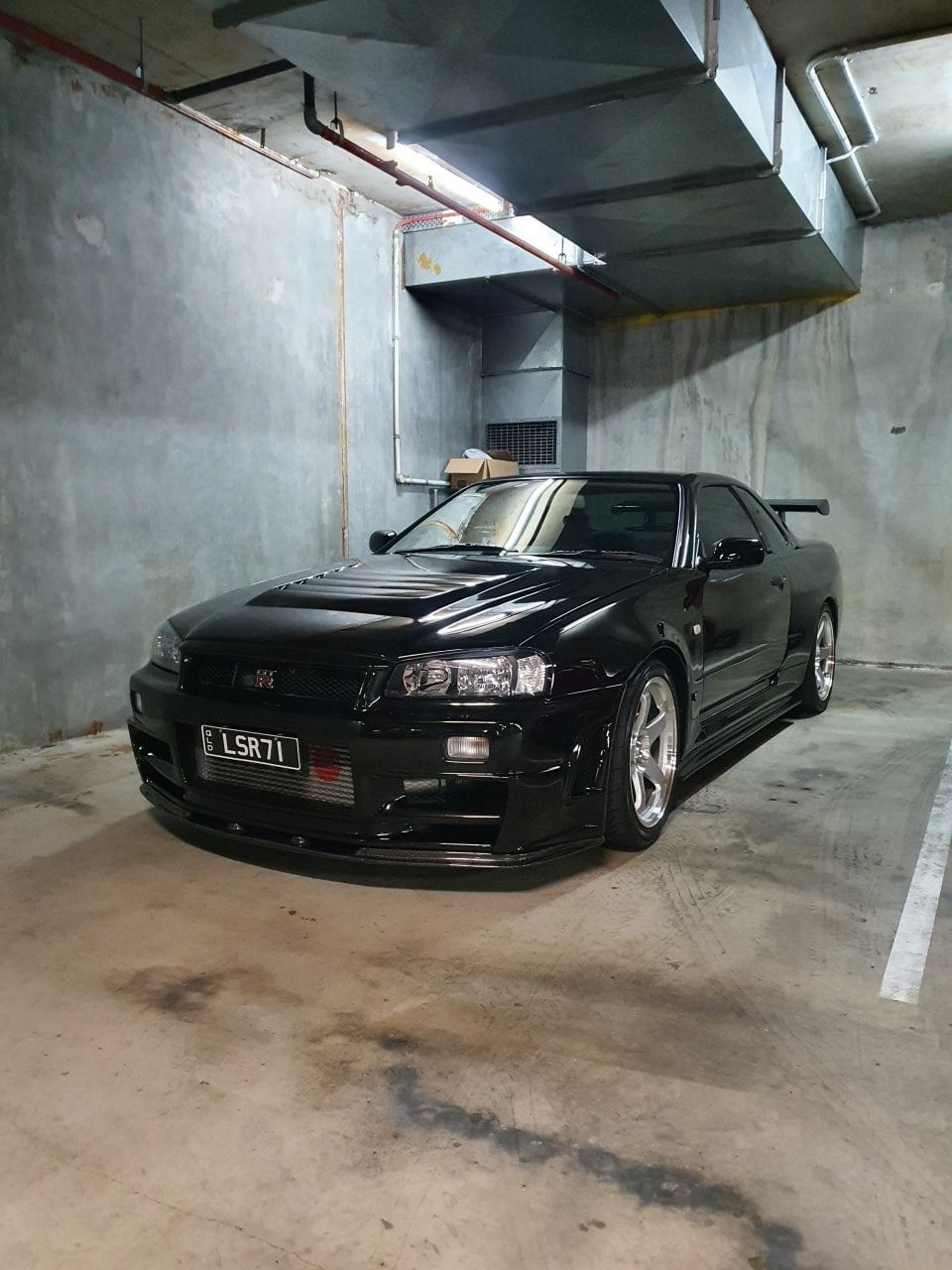 A Black Car is Parked in a Parking Garage — SVS Auto Repairs & Dyno Tuning in Bungalow, QLD