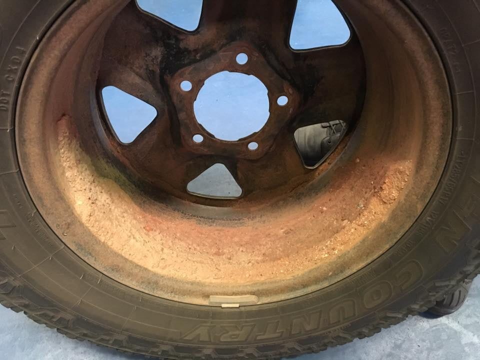 A Close Up of a Rusty Wheel With a Tire on It — SVS Auto Repairs & Dyno Tuning in Cairns, QLD