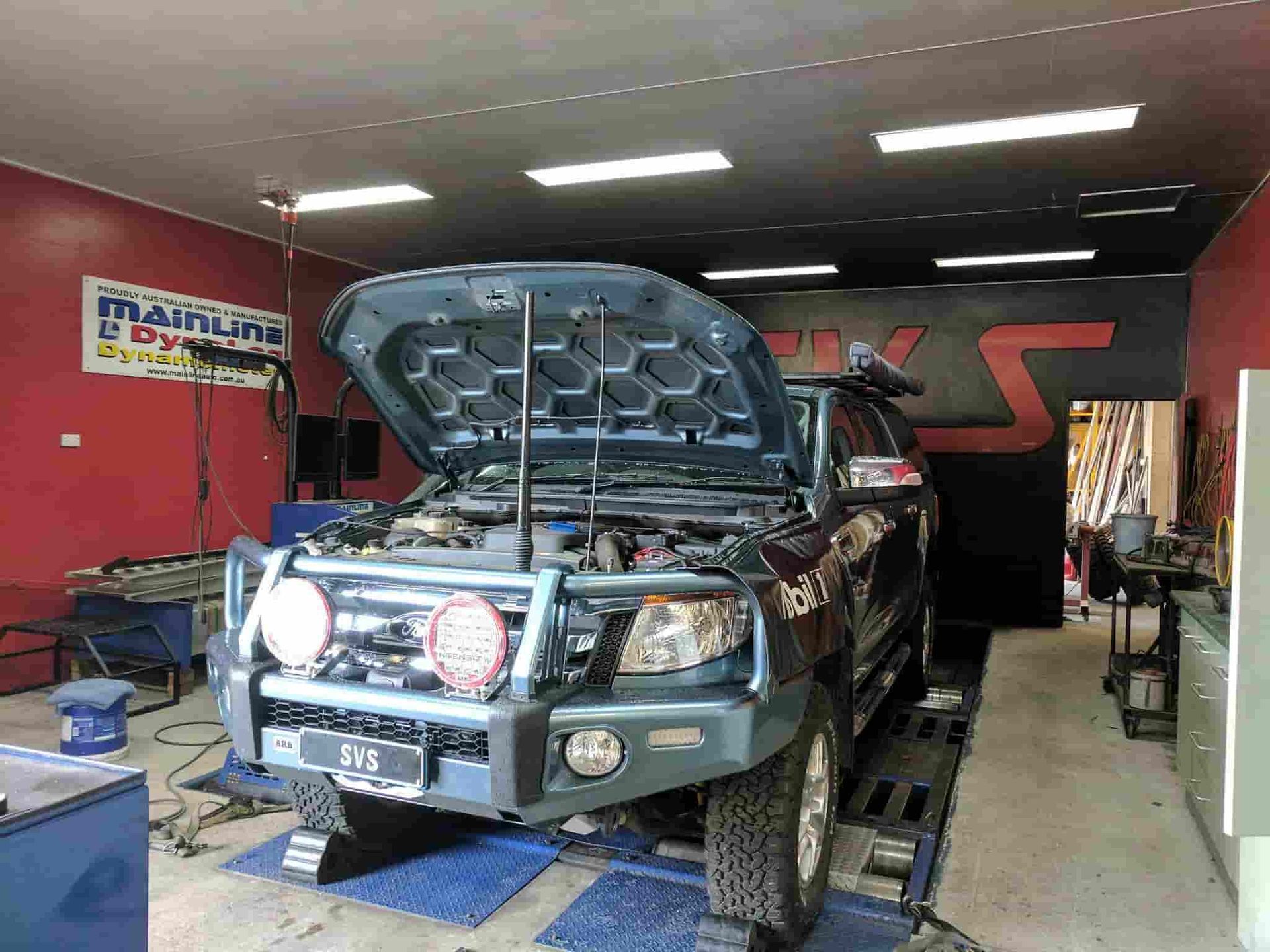 A Truck With the Hood Up is Sitting in a Garage — SVS Auto Repairs & Dyno Tuning in Cairns, QLD