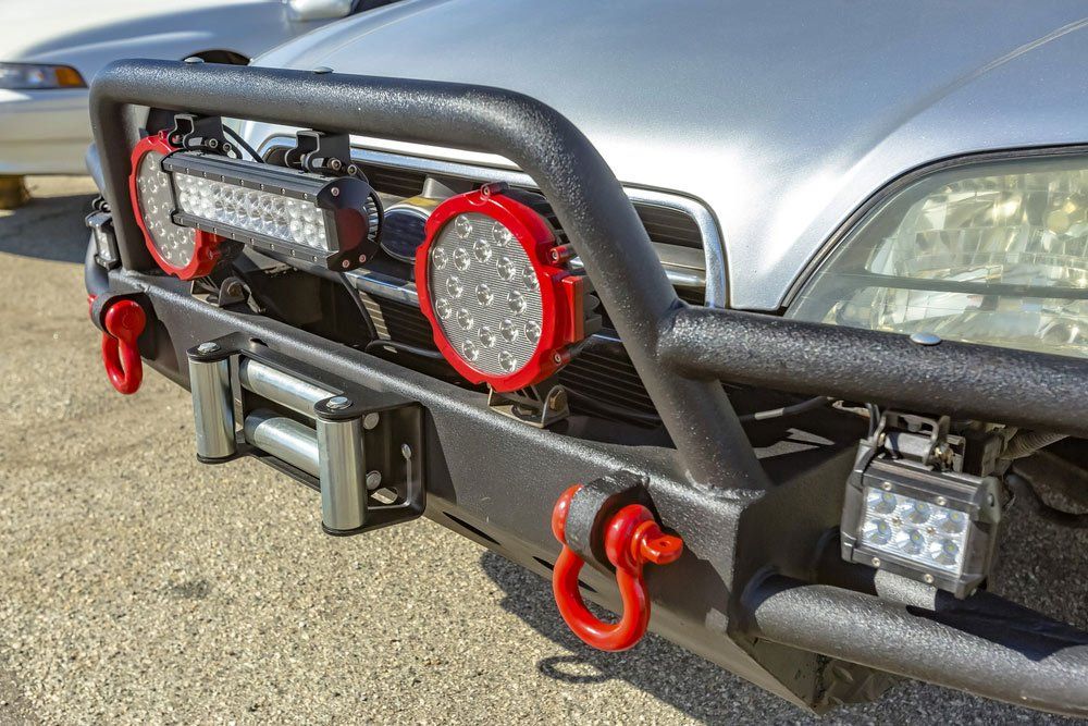 A Car With a Bumper and Lights on It is Parked in a Parking Lot — SVS Auto Repairs & Dyno Tuning in Cairns, QLD