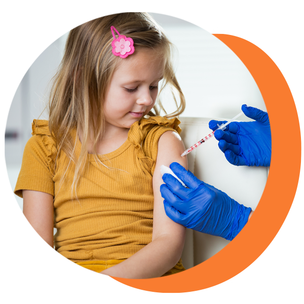 A little girl is getting a vaccine in her arm