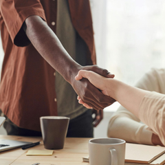 Cleaning service and customer shake hands