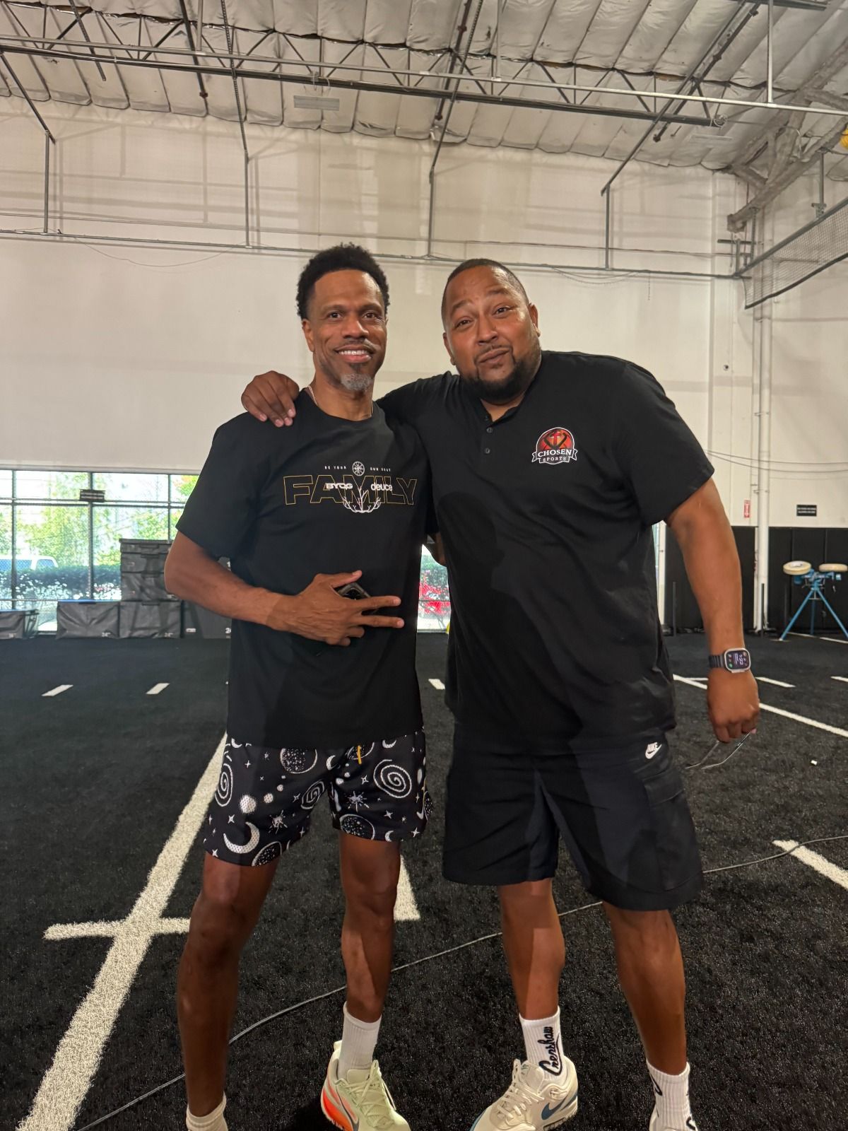Baseball balls resting on green grass.