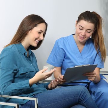 Dentists checking a womans teeth