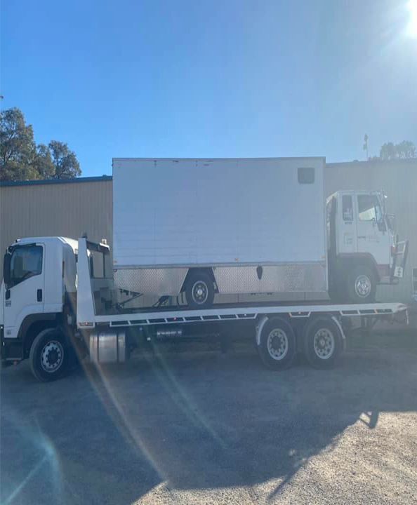 Large Truck Being Towed by a Tow Truck — Port Macquarie Tilt Tray Towing in Telegraph Point, NSW