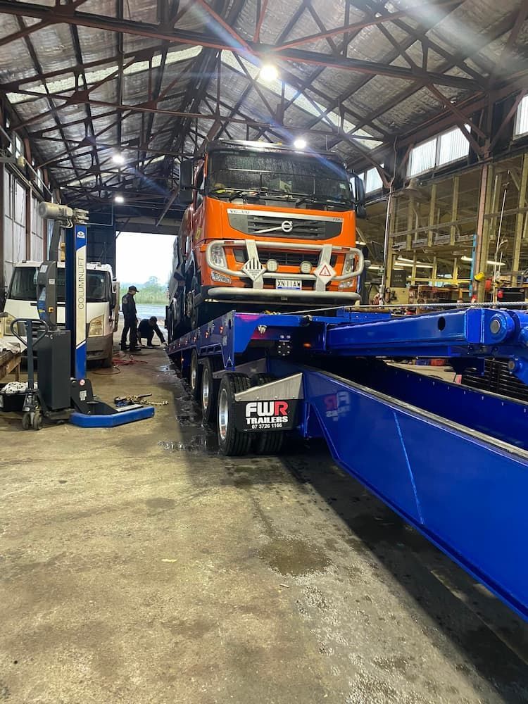Tow Truck Carrying a Large Size Truck — Port Macquarie Tilt Tray Towing in Telegraph Point, NSW