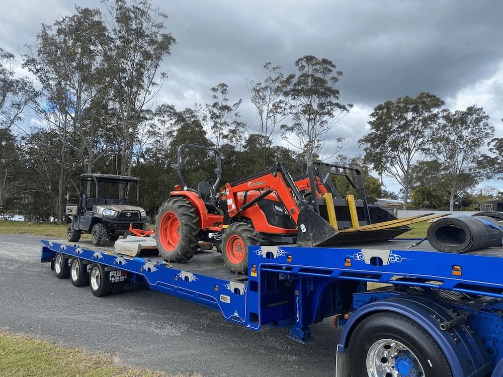 Forklift and Golf Cart Hauled on Tow Truck — Port Macquarie Tilt Tray Towing in Telegraph Point, NSW