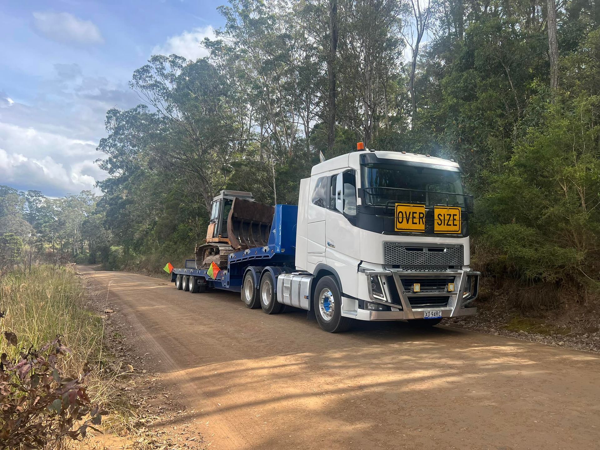 Yellow Tractor is Loaded on Truck — Port Macquarie Tilt Tray Towing in Telegraph Point, NSW