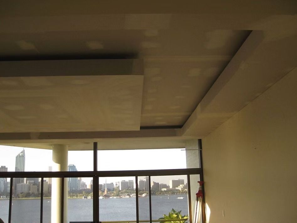 A room with a view of a body of water