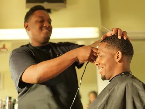 Man Getting His Hair Cut At Barber Shop — Silver Sping, MD — Montgomery Beauty School