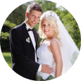 A bride and groom are posing for a picture on their wedding day.