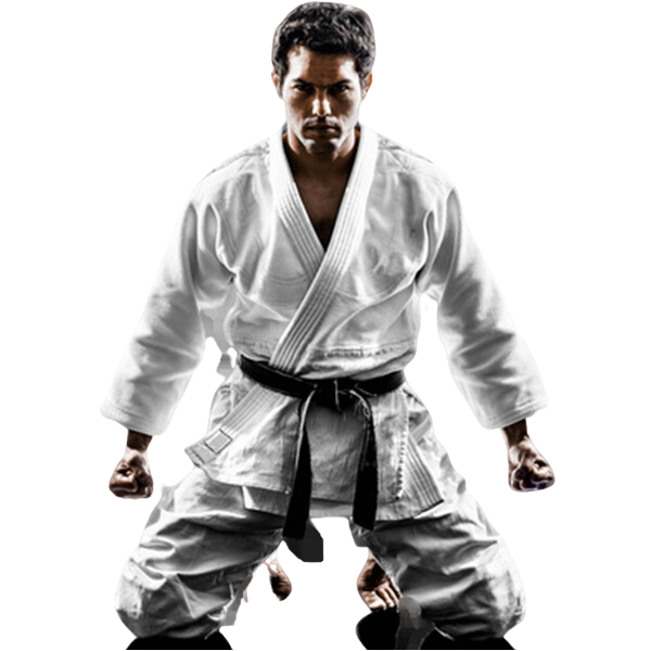 A man in a white karate uniform with a black belt is kneeling down.