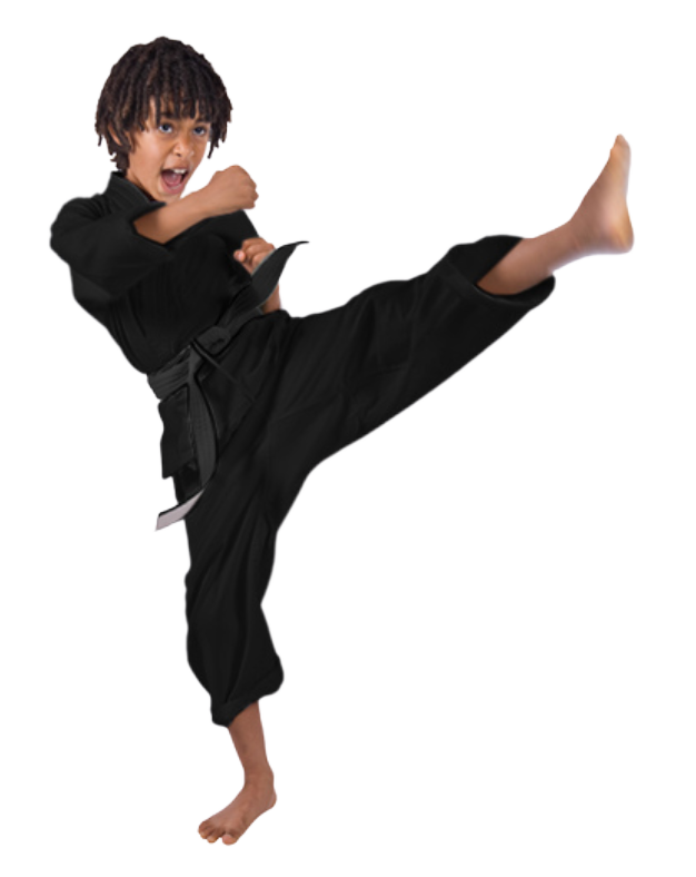 A young boy in a black karate uniform is kicking in the air