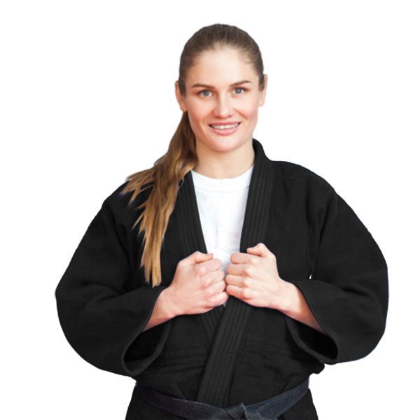 A woman in a black karate uniform is smiling