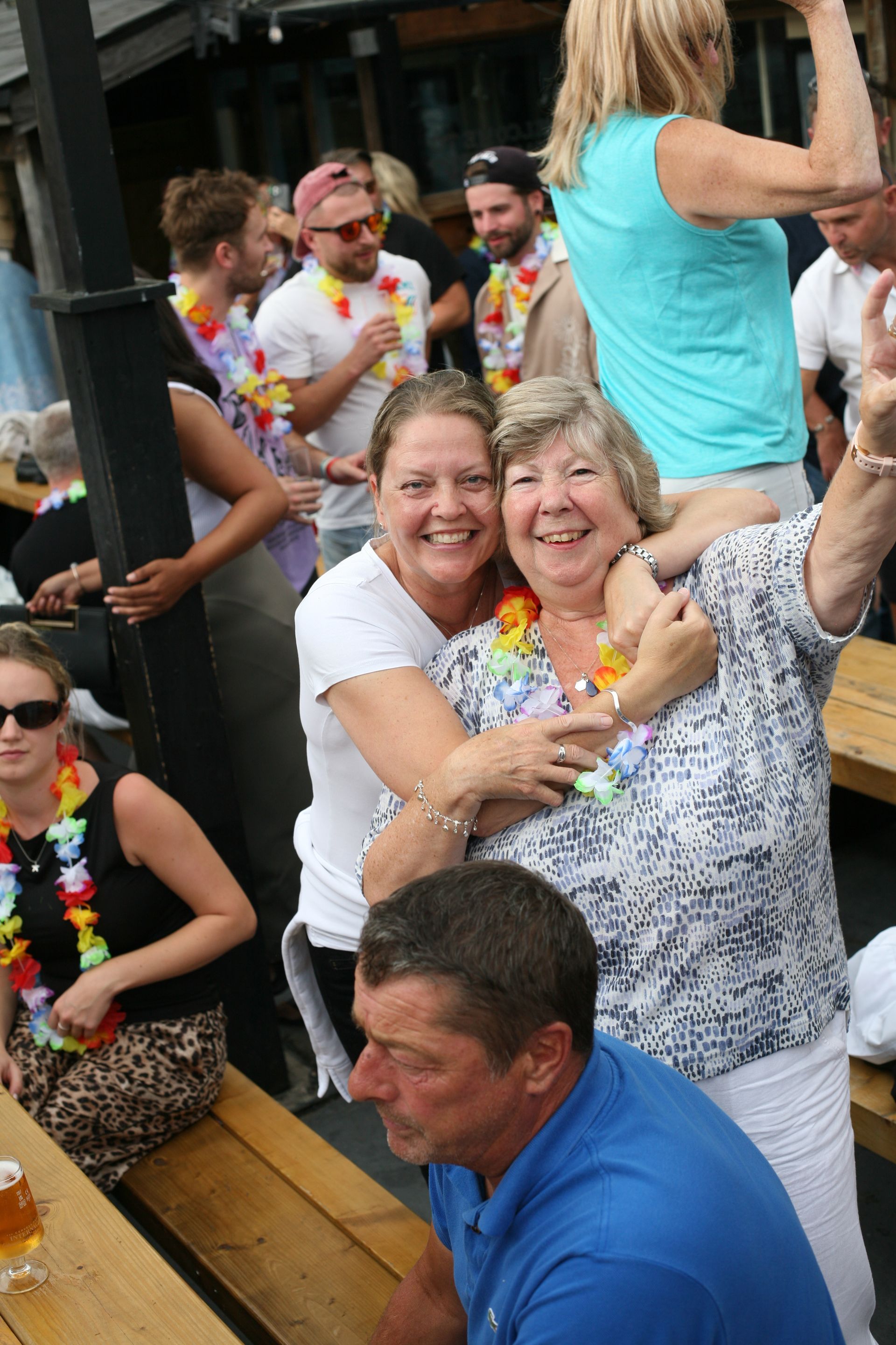 A group of people are posing for a picture at a party.