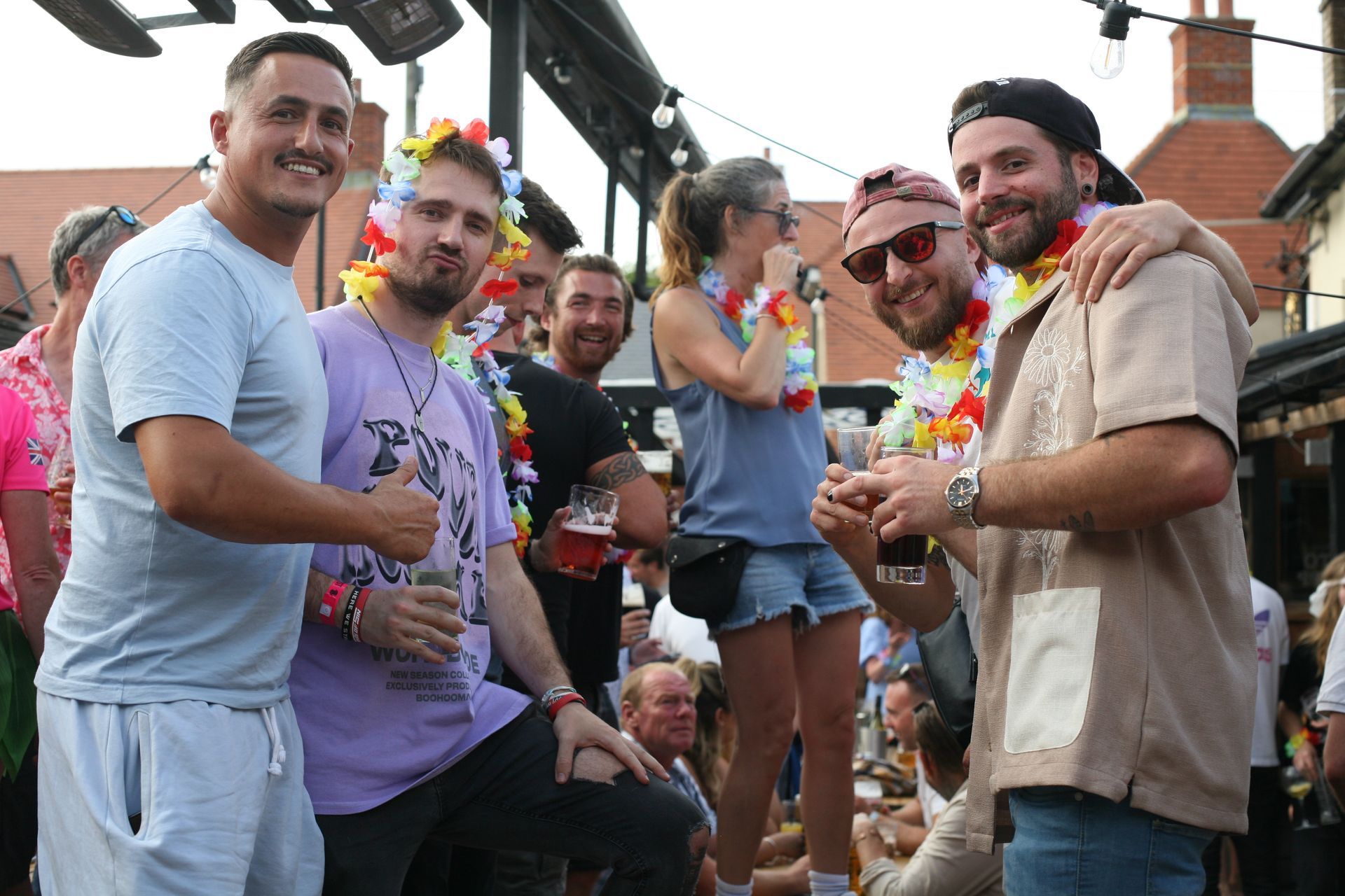 A group of people are standing next to each other at a party.