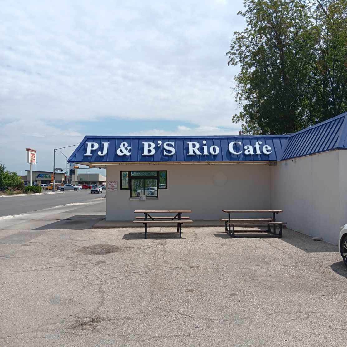 Pj & b 's rio cafe is located on the side of the road