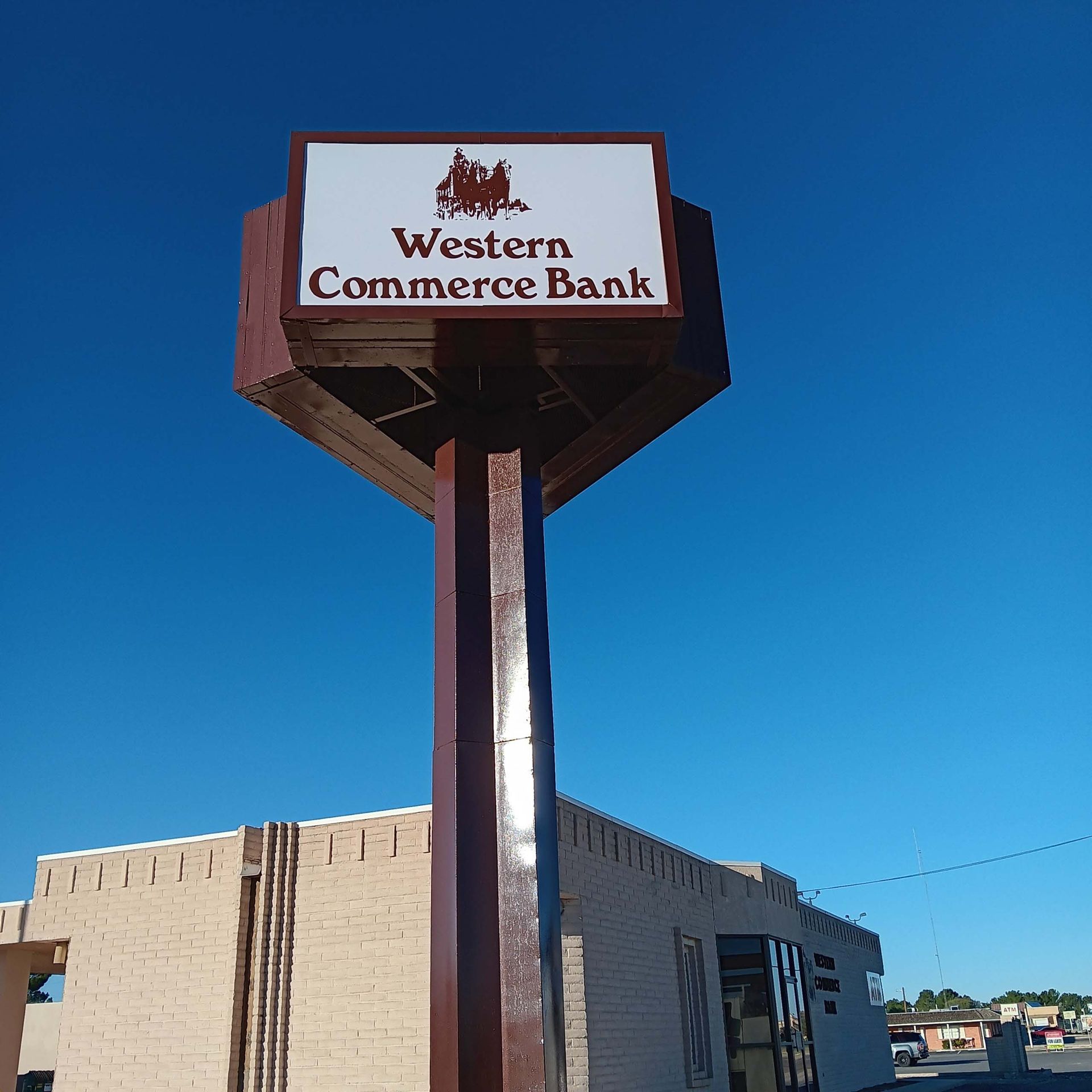 A sign for western commerce bank stands in front of a building