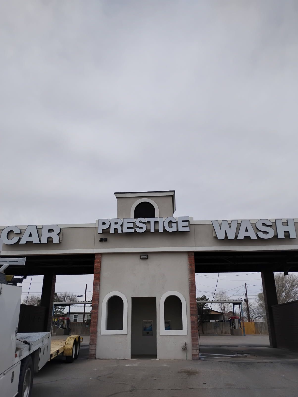 A car wash with a truck parked in front of it.