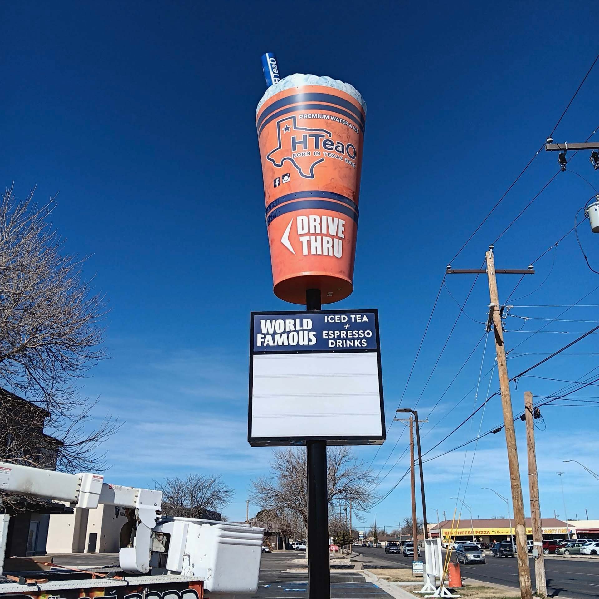 A sign that says drive thru on it