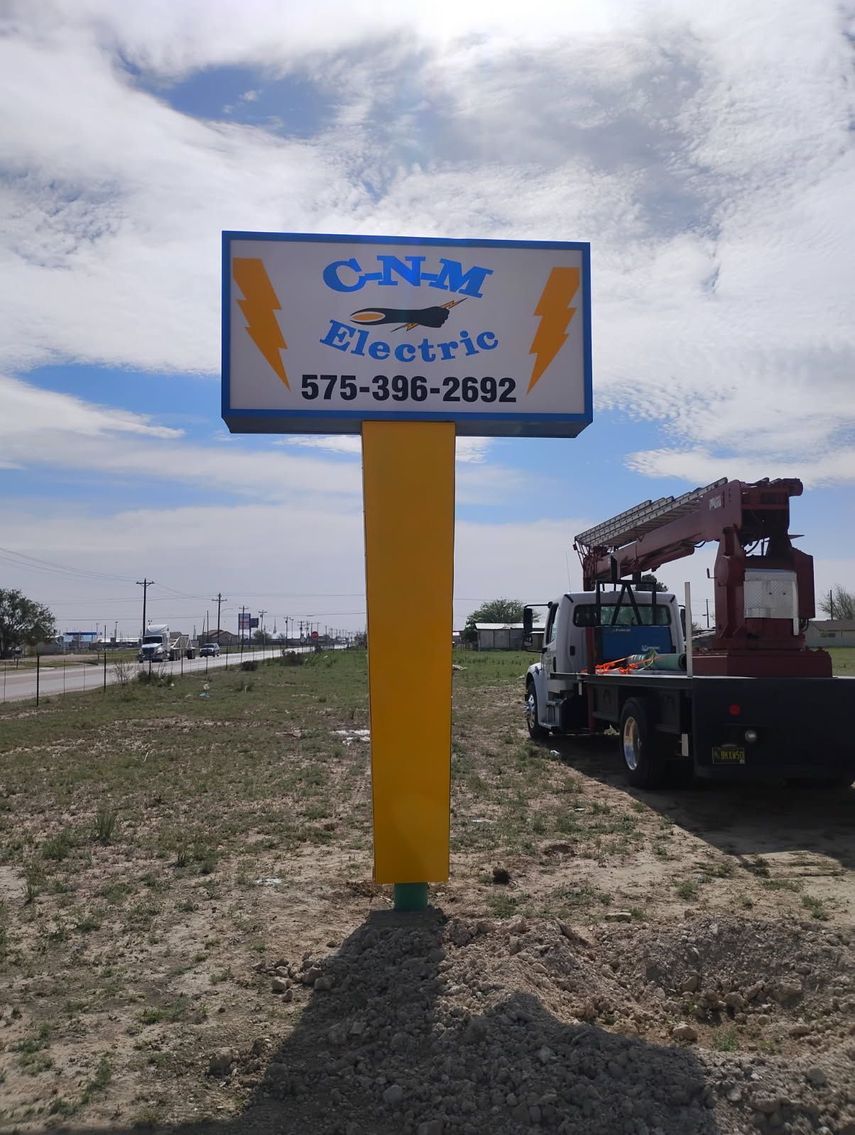 A sign that says cnm electric on it