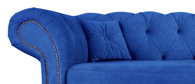 Navy blue sofa with pillows on wooden legs isolated on white. Darck blue suede couch isolated