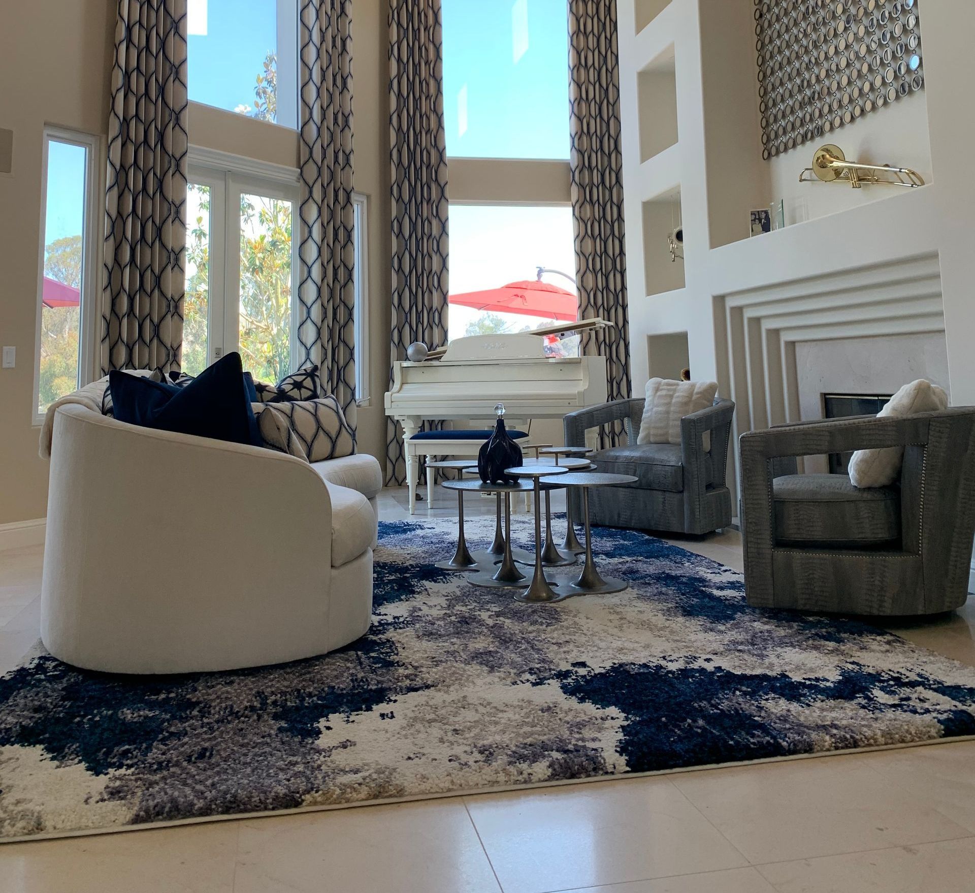 A living room filled with furniture and a piano