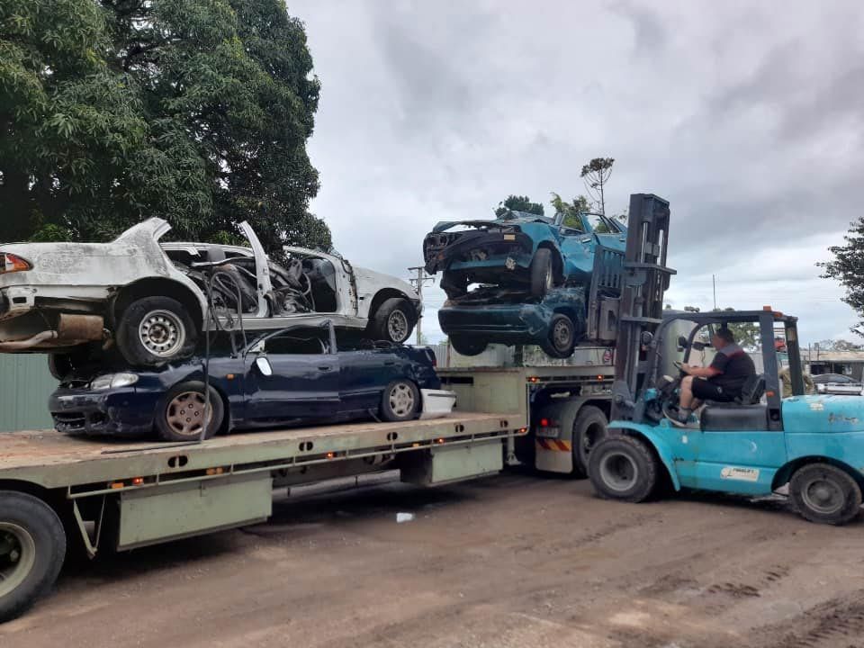 Loading Wrecked Cars Onto Tow Truck — Goodall's Automotive Services & Wreckers in Cluden, QLD